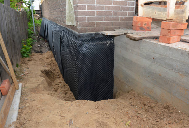Happy homeowners after waterproofing job in Goodrich